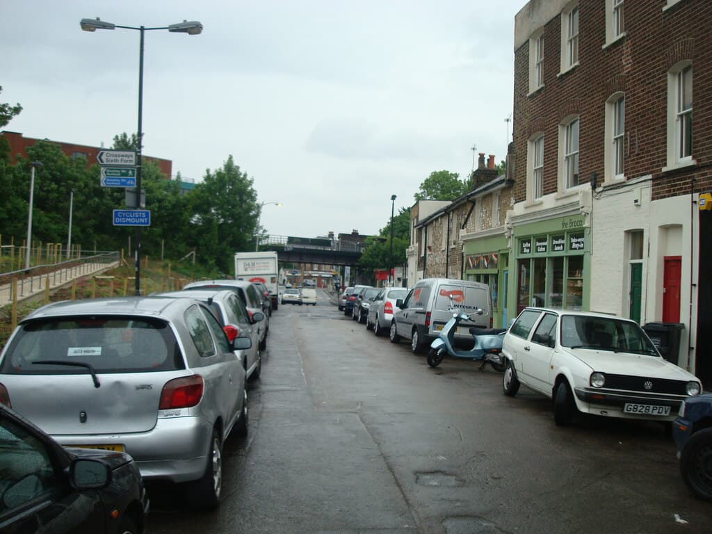 Coulgate Street lined with parked cars on both sides in 2010, looking towards the railway bridge
